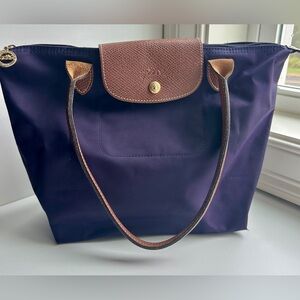 Well loved Lonchamp Le Pliage bag Pretty purple color.